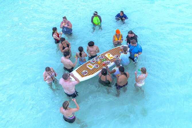Catamaran Snorkeling to El Cielo and The Money Bar Beach Club - Onboard setup: snorkeling gear, life vests, and free-flow drinks